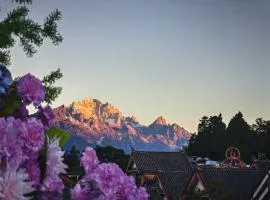 The Mountain-View Terrace Hotel ,Coffee and Tea Villa at The Big Waterwheel,A luxury hotel featuring private terraces for snow mountain views, Western & Chinese breakfast, afternoon tea, English speaking service, and ticket reservation service