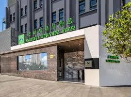 Mai Xinge Boutique Hotel - Free shuttle buses are provided between PVG Airport and Disneyland