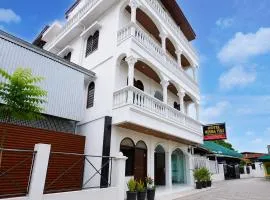 Hotel O near Masjid Raya Al-Mashun formerly Hotel Wisma Yuli