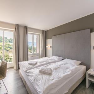 Twin Room with Balcony & Partial Lake View