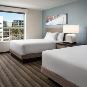 One-Bedroom Specialty Suite with Two Queen Beds, Kitchen and Sofa Bed