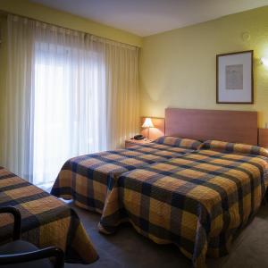 Triple Room (2 Adults + 1 Child )
