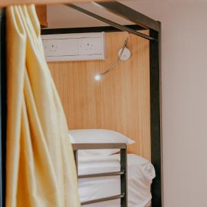 Bed in 8-Bed Mixed Dormitory Room with Shared Bathroom