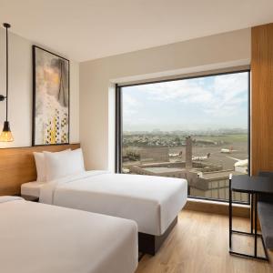 Deluxe Twin Room with Garden View with 50% discount on Buffet , 10% off on Airport Transfers , Laundry and Happy Hours on beverages enjoy 1+1 offer on select beverages