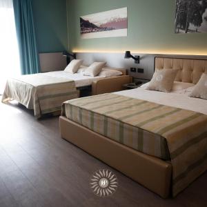 Superior Triple Room With Balcony and Partial Lake View