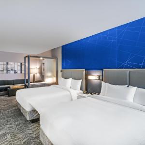 Queen Suite with Two Queen Beds, Street View, Roll-In Shower and Trundle Sofa - Mobility Access