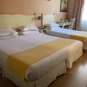 Triple Room (3 Adults or 2 Adults + 1 Child)