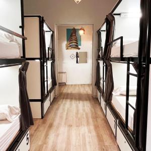 Bed in 12-Bed Dormitory Room with Shared Bathroom