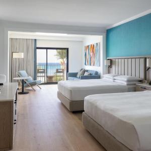 Junior Suite with Two Double Beds Oceanfront View  and Balcony