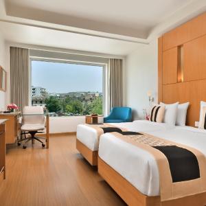 Deluxe Double Room: Enjoy a Buy One Get One offer at Fire Ball Bar (11 AM - 8 PM) on House Brand, 15% off on Food & Soft Beverages and Spa, Early checkin Available up to 2 hours (subject to availability)