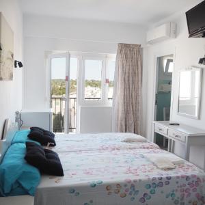 Twin Room with Balcony City Views