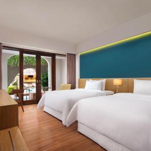 Deluxe Twin Room with Pool Access - Garden Level with  Free Mini Bar, Daily Shuttle to Monkey Forest, Daily Yoga, Free Bike to borrow,  Free Family Activity and 24 Hour access to Motion Fitness Center.
