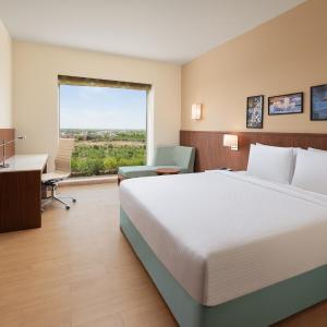 Premium King Room (15% Discount on food & soft beverage at Kava Restaurant, Happy Hours (Buy 1 Get 1) on IMFL beverages at the BAR)