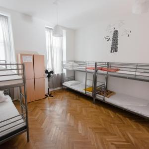 Bed in 8-Bed Dormitory Room with Shared Bathroom