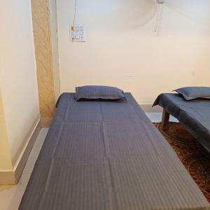 Single Bed in Dormitory Room