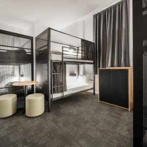 Bed in 6-Bed Male Dormitory Room with Shared Bathroom