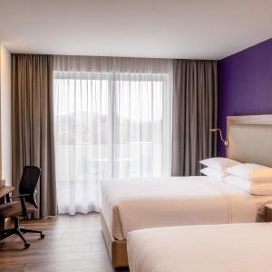 Deluxe Queen Room with Two Queen Beds and Balcony - City View