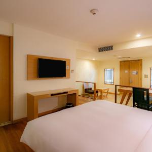 King Suite with Sofa Bed and Garden View