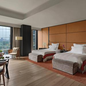 Deluxe Room with Two Double Beds and City View (Free Mini-bar soft drinks & beers + 1.9 mi pick-up or drop-off service + 4.6 feet wide double beds)