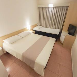 Room with a Double Bed and One Single Bed