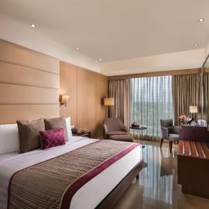 Executive Room with alcoholic / non - alcoholic house drinks , a platter of Fruits and Cookies , 01 way airport transfers, 10% off on food & soft beverages, complimentary sauna and steam once during the stay