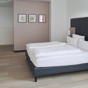 Premium Family Room with Two Queen Beds and Single Sofa Bed