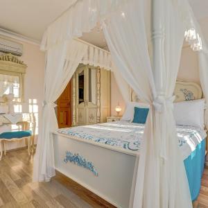 Upper Story Room with Draped Beds