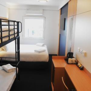 Standard Family Room with One Queen and Double Deck Bunk Beds