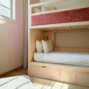 Triple Bunk Room with Three Twin Bunk Beds and Pool View