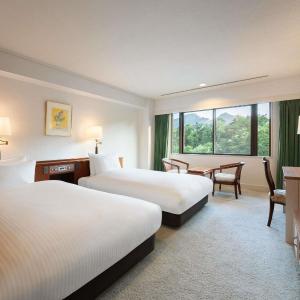 Classic Deluxe Suite with Four Single Beds and Mountain View