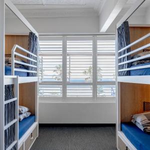 Bed in 8-Bed Mixed Dormitory Room with Beach View and Shared Bathroom