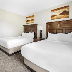 Two-Bedroom Deluxe Suite with One King Bed, Two Double Beds and Balcony