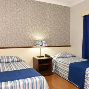 Quarto Duplo com Varanda - 2 Camas de Solteiro