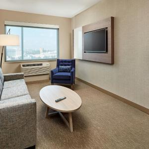One-Bedroom Family Suite with One King Bed, Bunk Beds, Pool View, Two Sofa Beds and Bathtub - Mobility Access