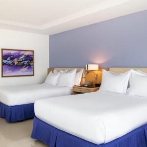 Two Queen Beds Corner Suite with City /Ocean View
