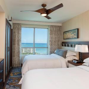 One-Bedroom Luxury Suite with Two Double Beds and Ocean View