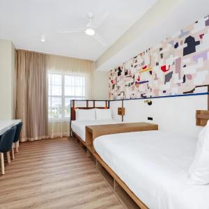 Two-Bedroom King Suite with Two Queen Beds and Sofa - Balcony/Kitchen
