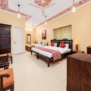 Classic Quadruple Room -  Includes free pickup from airport/ train station / bus station via tuk-tuk, & a dedicated travel desk to assist with local sightseeing tours, intercity travel arrangements & activities.