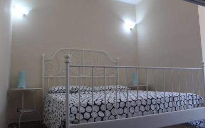 Camera Quadrupla con Vista Giardino 