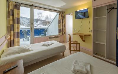 Chambre Quadruple Basique (2 Adultes + 2 Enfants)