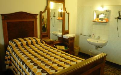 Camera Quadrupla con Bagno in Comune - Letti Singoli