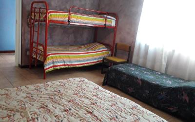 Camera Familiare con Vista Giardino