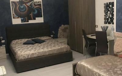 Camera Tripla con Vista Giardino