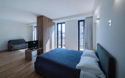 Camera Quadrupla Superior