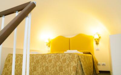 Camera Quadrupla Superior