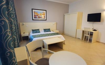 Camera Quadrupla Superior