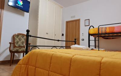 Camera Quadrupla con Vista Giardino 