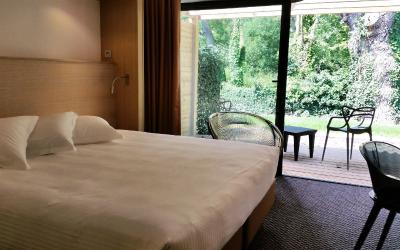 Chambre Double ou Lits Jumeaux avec Accu00e8s au Spa - Vue sur Jardin Chambre Double ou Lits Jumeaux avec Accu00e8s au Spa - Vue sur Jardin