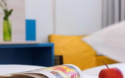 Familienzimmer mit 2 Einzelbetten und Schlafsofa 