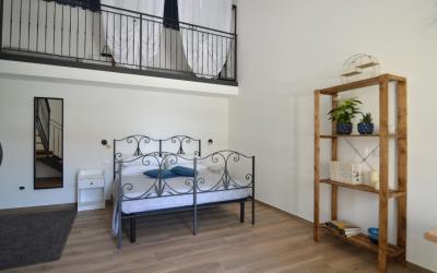 Camera Quadrupla con Vista Giardino 